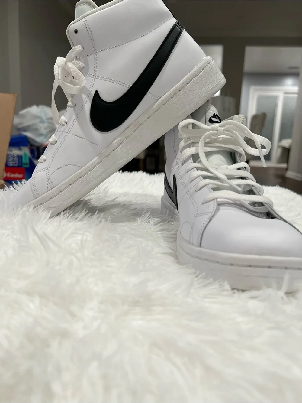 Nike White High-Top Sneakers with Black Swoosh and Tan Heel Tab